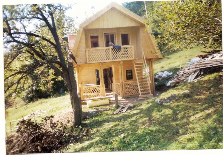 Square milled log house
