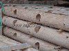 machine-rounded poles, palisades. Fencing poles.