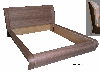 Bed with curved wooden components